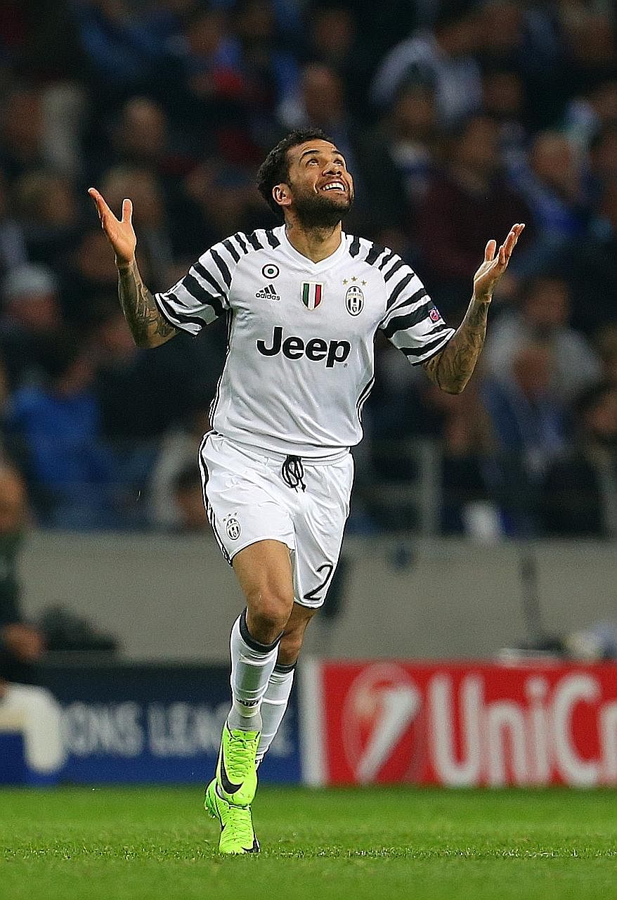 Juve defender Dani Alves celebrating after scoring his team's second goal in the 2-0 Champions League last-16 first-leg win over Porto.