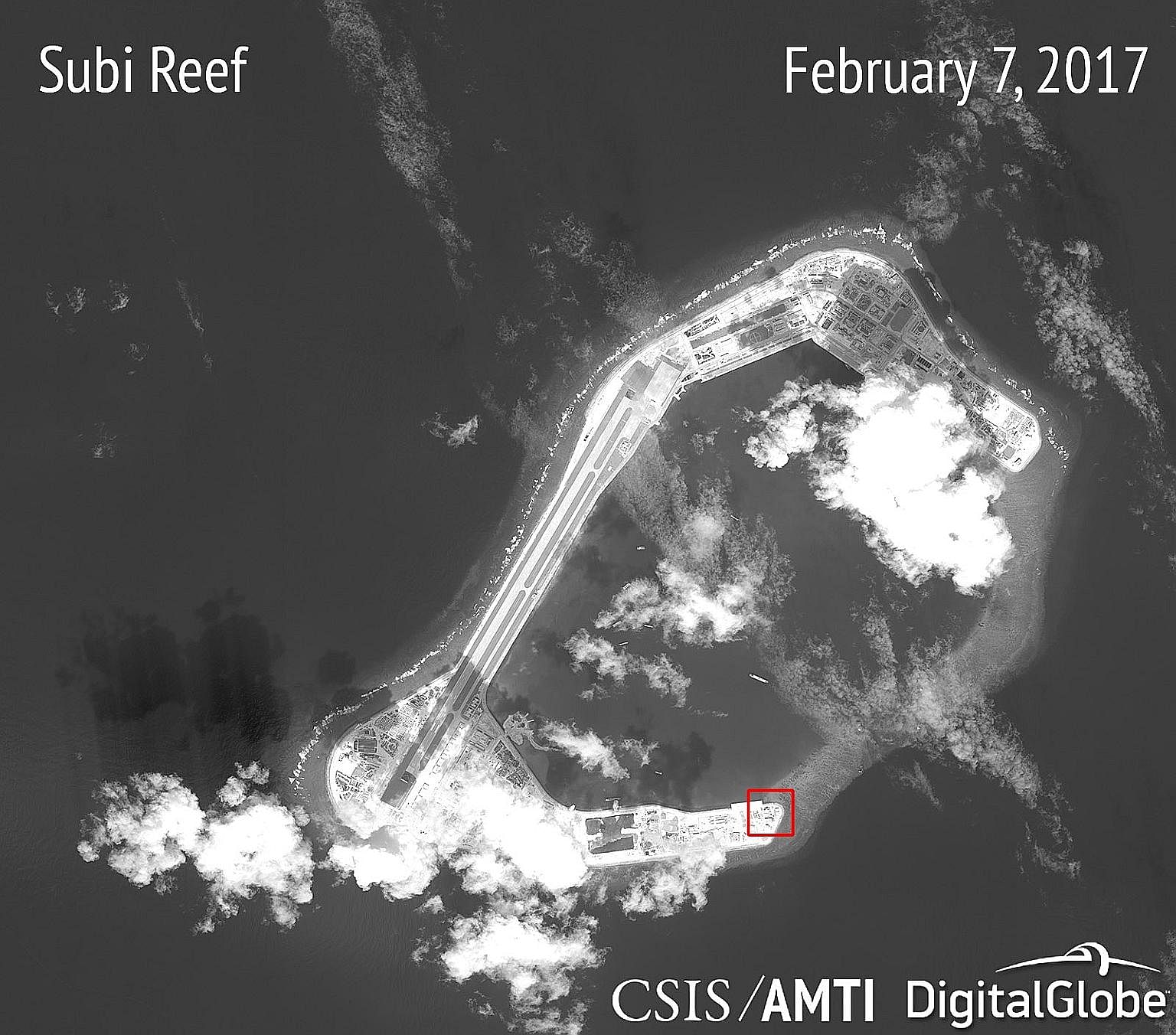 Satellite images, released on Wednesday, showing what seem to be concrete structures with retractable roofs on Subi Reef (left) and Fiery Cross Reef (above).