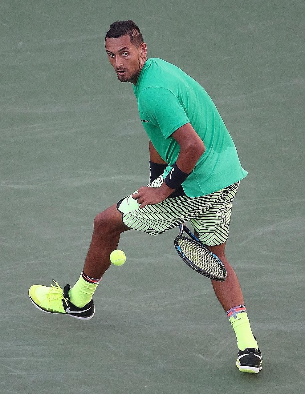Nick Kyrgios hitting a "tweener", or a return between his legs, on the way to a 6-4, 7-6 (7-3) win against Novak Djokovic at the Indian Wells Masters on Wednesday. The Serb was bidding for a fourth straight title in the Californian desert, but fell t