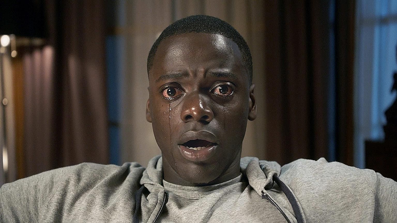 Daniel Kaluuya plays a man whose life takes a horrific turn after visiting his white girlfriend’s liberal parents in the thriller, Get Out. 