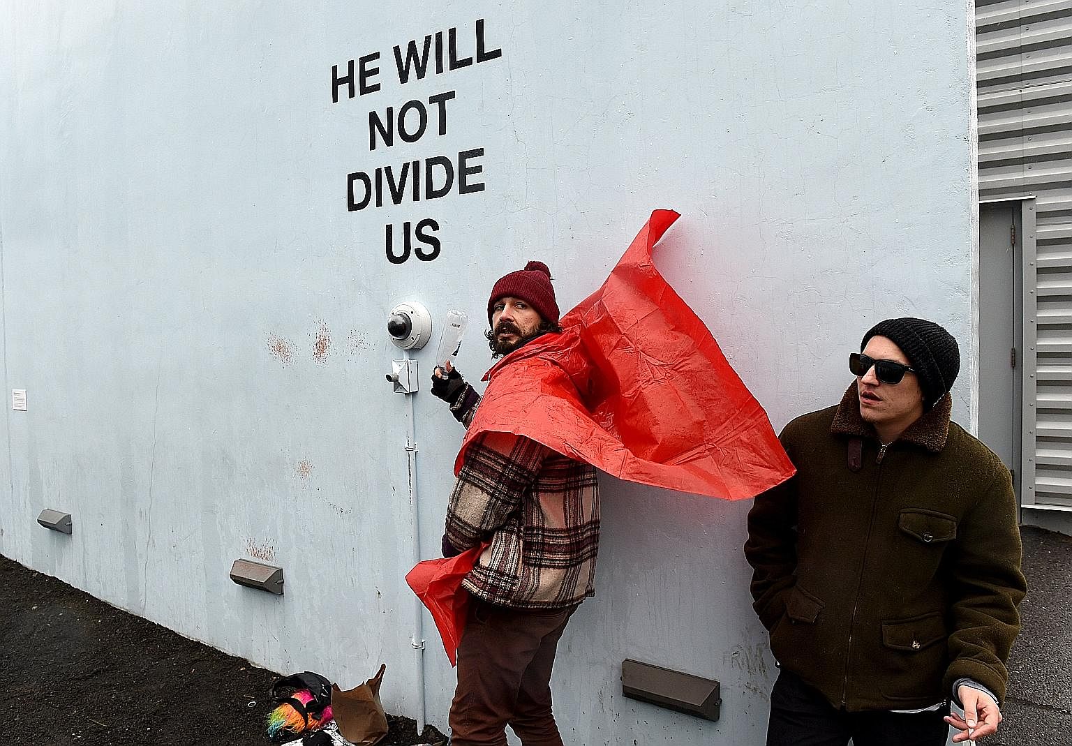 American actor Shia LaBeouf (left) during a livestream of his "He Will Not Divide Us" project in New York on Jan 24. The project has had to relocate for the fourth time due to disruptions by 4chan users.