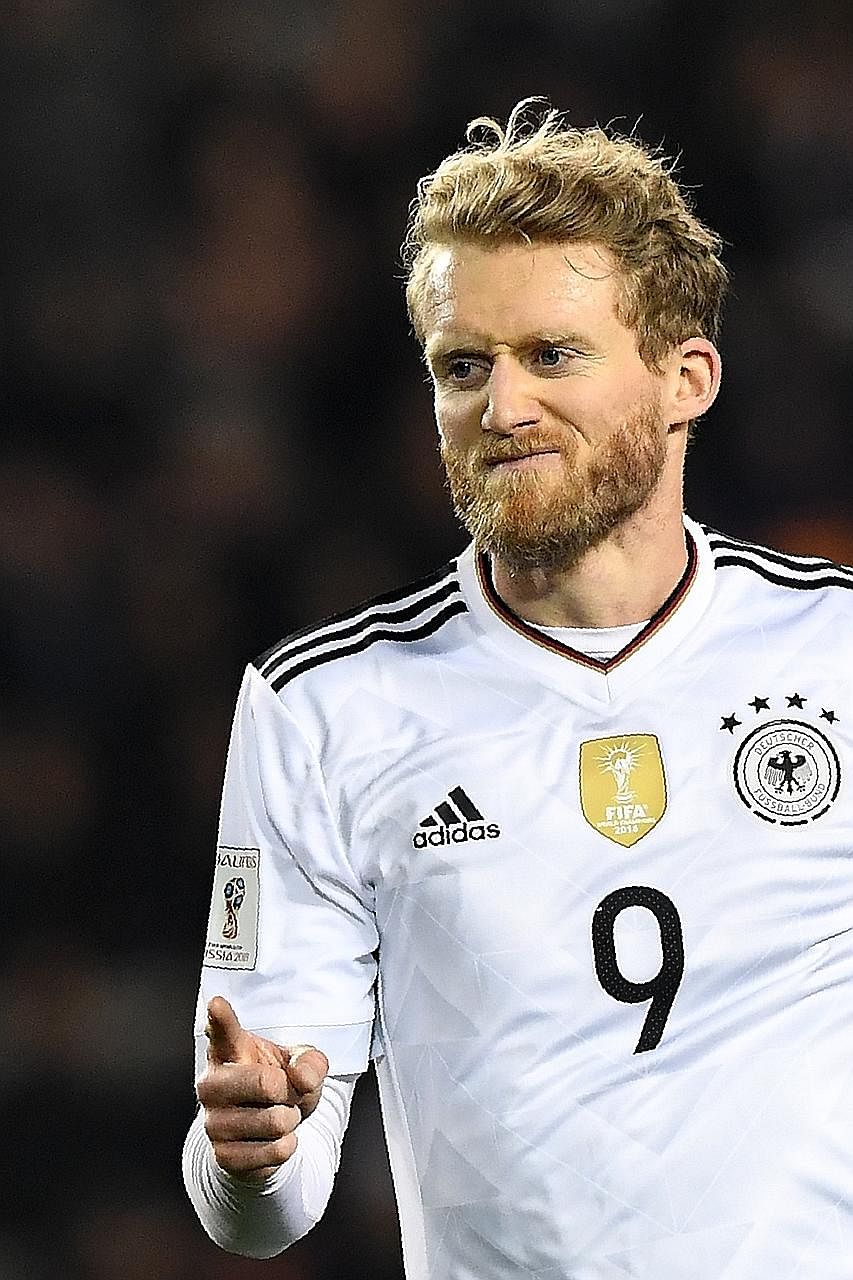 Germany's Andre Schurrle celebrates the first of his double in a less-than- vintage 4-1 win over Azerbaijan.