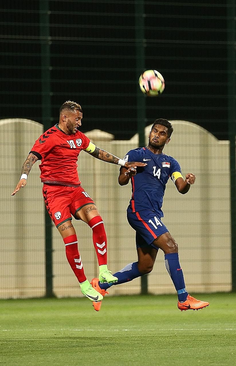 Hariss Harun, captain for the friendly against Afghanistan last week in Doha, challenging Faysal Shayesteh in the 1-2 loss. He says that although a point will be great against Bahrain tonight, the team will hope to win.