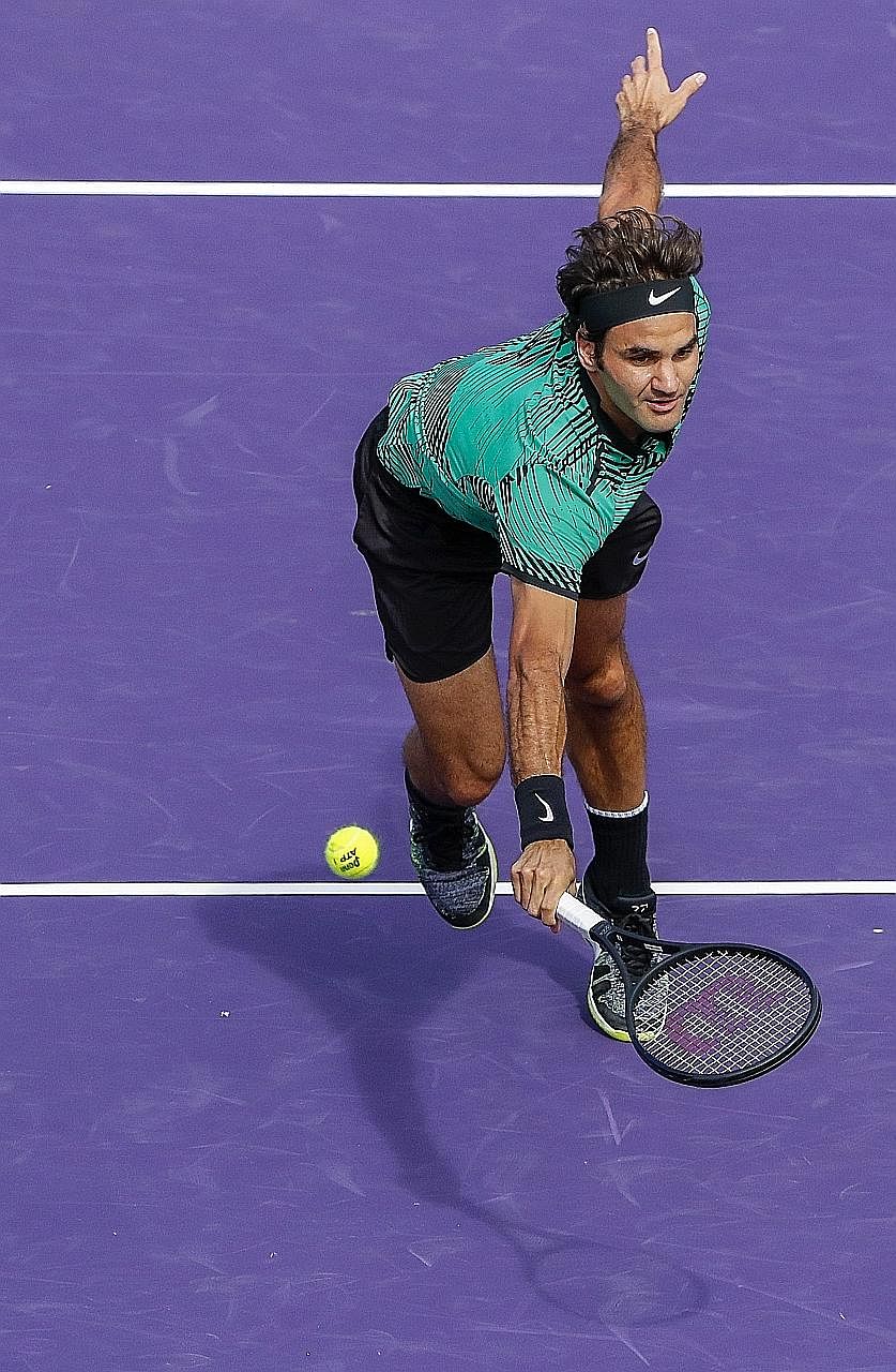 Tennis great Roger Federer stretches to return a shot against Tomas Berdych at the Miami Open. Federer won 89 total points in their semi-final - two fewer than the Czech, but prevailed after Berdych double-faulted on match point.