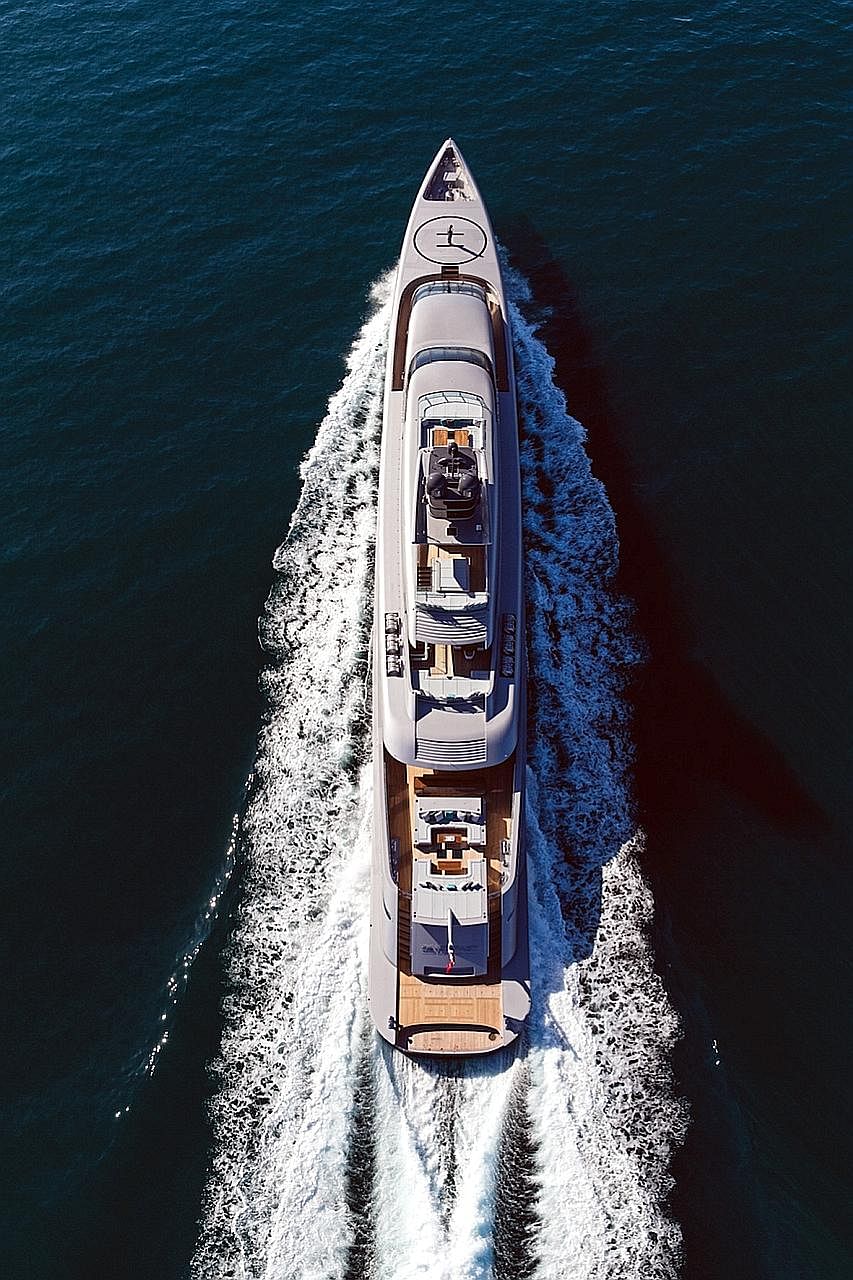 The 77m-long Silver Fast (left) can accommodate 18 guests in seven en suite cabins and a dedicated owner's apartment. The 41m-long Ocean Emerald (top), which has open exterior deck spaces for al fresco dining, a jacuzzi (above), home cinema and cappu