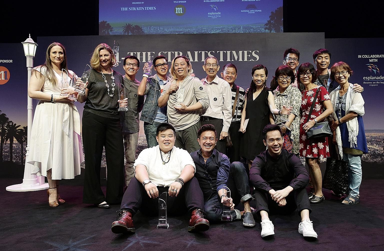 Actor Dwayne Lau, who won the Best Dressed prize, and Culture, Community and Youth Minister Grace Fu, the guest of honour at the awards, giving their best La La Land pose at the Esplanade yesterday. At yesterday's Life Theatre Awards were (standing, 