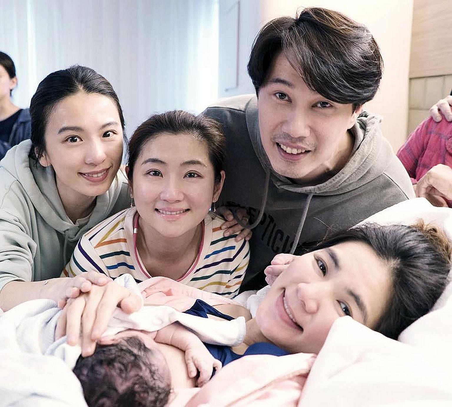 A handbag from Jeff Koons' Masters collection, a series which he collaborated on with Louis Vuitton. Ella Chen with her newborn, husband and S.H.E bandmates Selina Jen and Hebe Tien (far left).