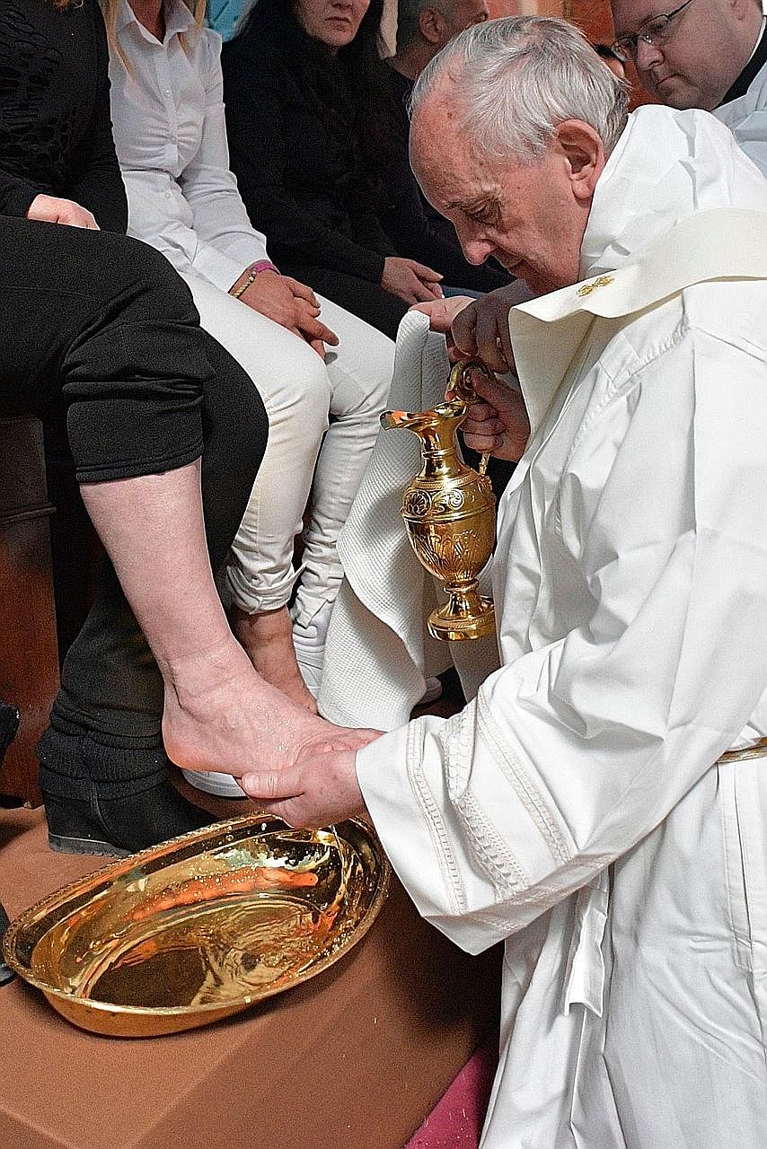 Pope Francis washing the feet of Paliano prison inmates on Thursday. The rite commemorates Jesus Christ's Last Supper with the apostles.