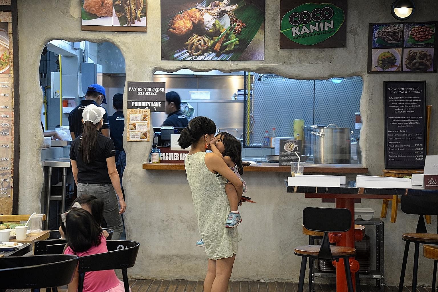 A familiar sign (above) for Singaporeans at Makansutra Hawkers, which has been drawing customers since it opened last year. Mr JJ Yulo (left) is chef and part-owner of Makansutra Hawkers, a 12-stall, kopitiam-style restaurant at a corner of Manila's 