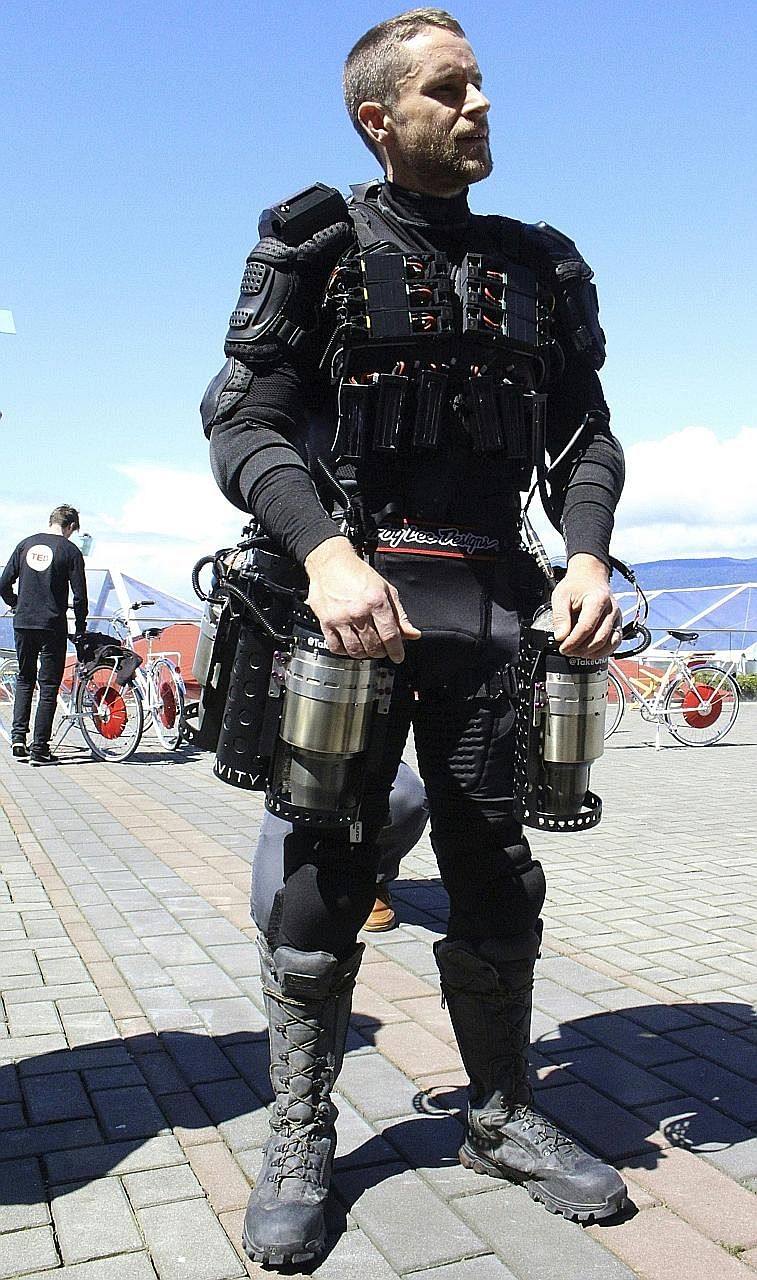 Engineer Richard Browning flew in a circle and hovered a short distance from the ground while wearing the personal flight suit at a TED Conference in Vancouver.