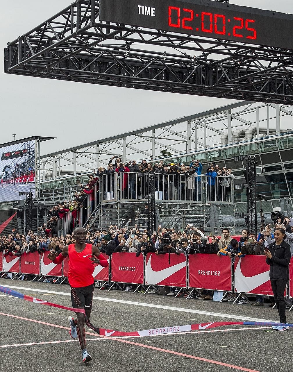 Marathon runner Eliud Kipchoge crossing the finish line at the Monza Formula One track in two hours and 25 seconds.