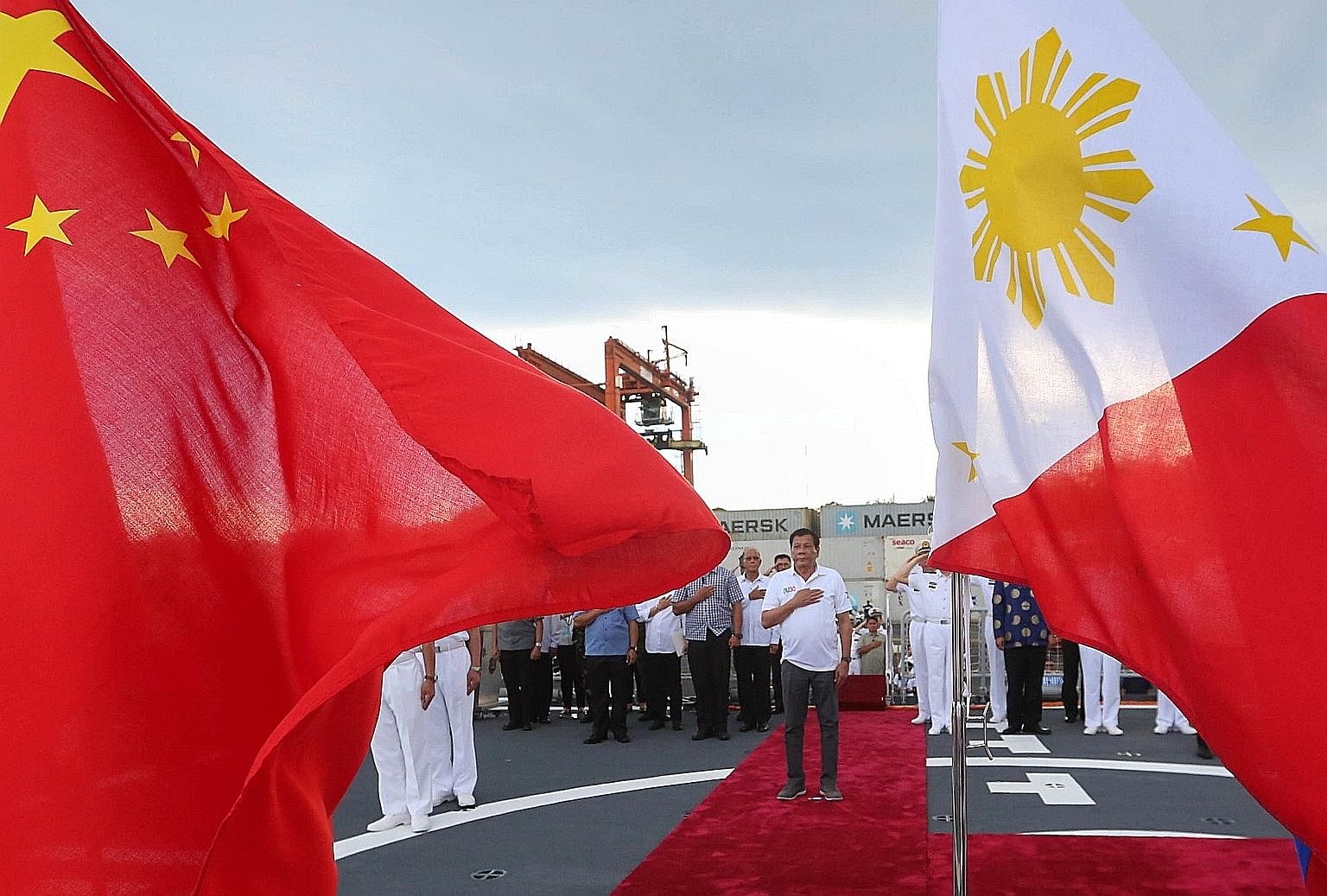 A handout photo made available by the Presidential Photographers Division shows Philippine President Rodrigo Duterte during a tour of a Chinese naval ship in Davao City, southern Philippines. He gave three Chinese warships the red-carpet treatment in