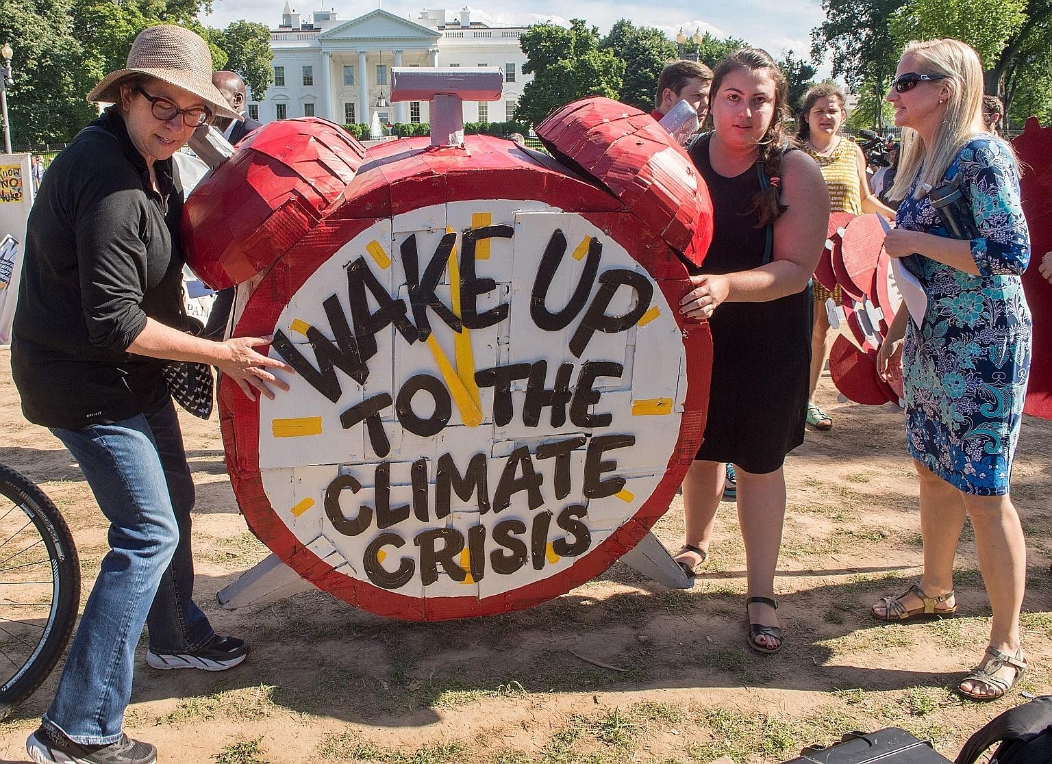 Protesters gathered in front of the White House on Thursday to oppose Mr Trump's decision to withdraw the US from the Paris accord.