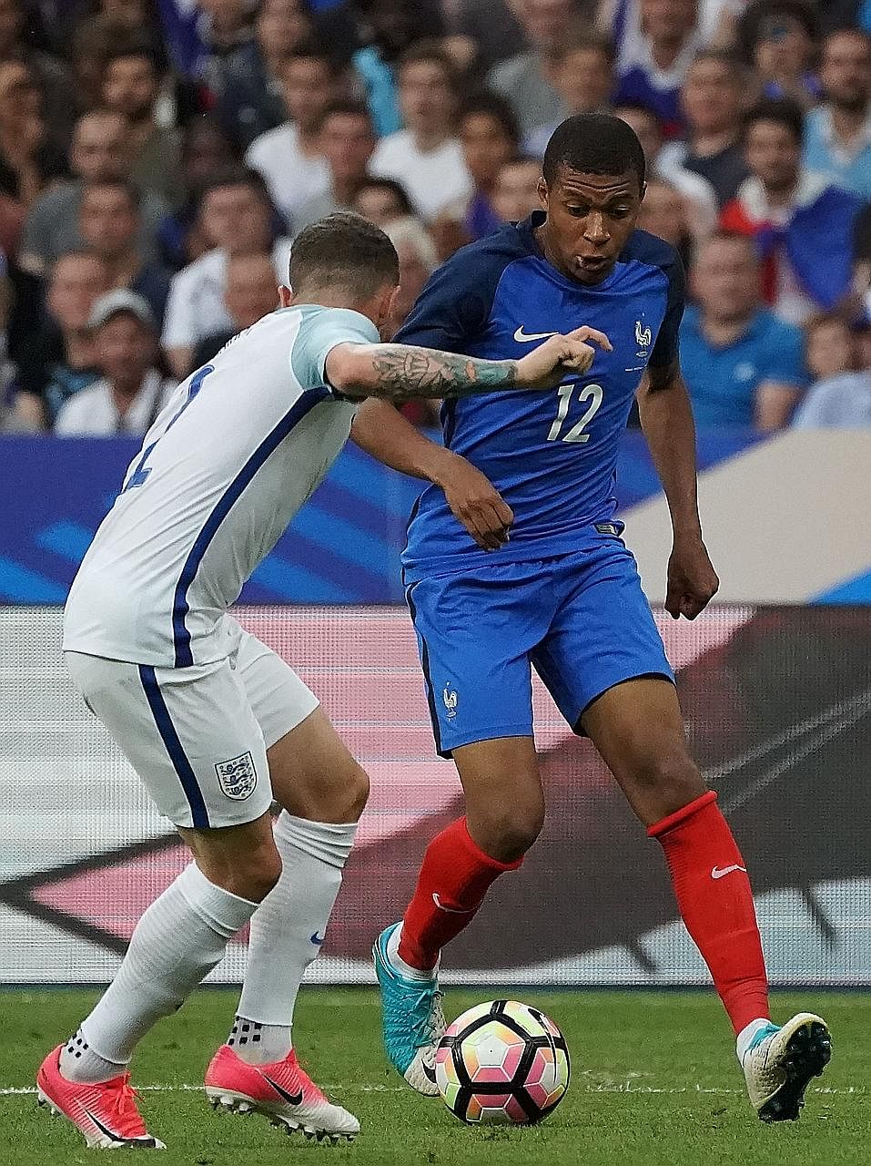 French teenager Kylian Mbappe (right) takes on England defender Kieran Trippier during the 3-2 victory against Gareth Southgate's team on Wednesday. Real Madrid are in pursuit of the Monaco forward, as are Paris Saint-Germain, Arsenal, Chelsea, Liver