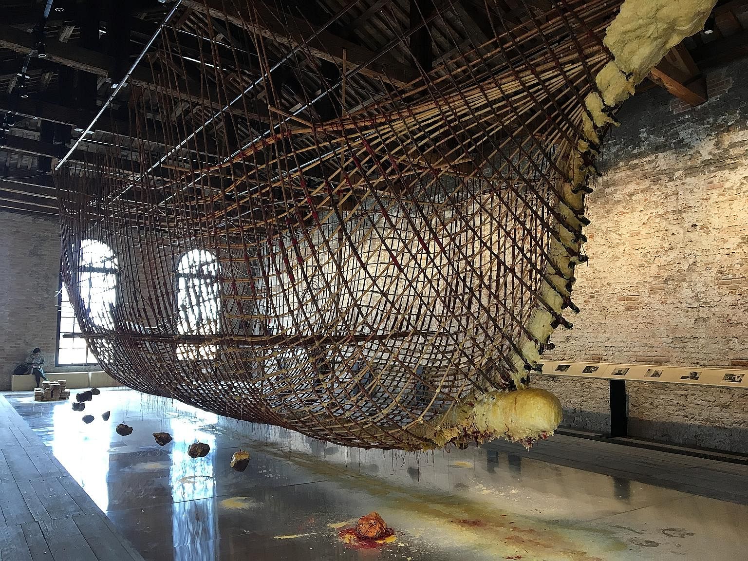 Artist Zai Kuning's suspended ship - the hull of a 12m-long seagoing craft made from rattan and bound together with beeswax and red cord - evokes Singapore's trading roots and the shared Melayu-Riau heritage of its people, says the writer.