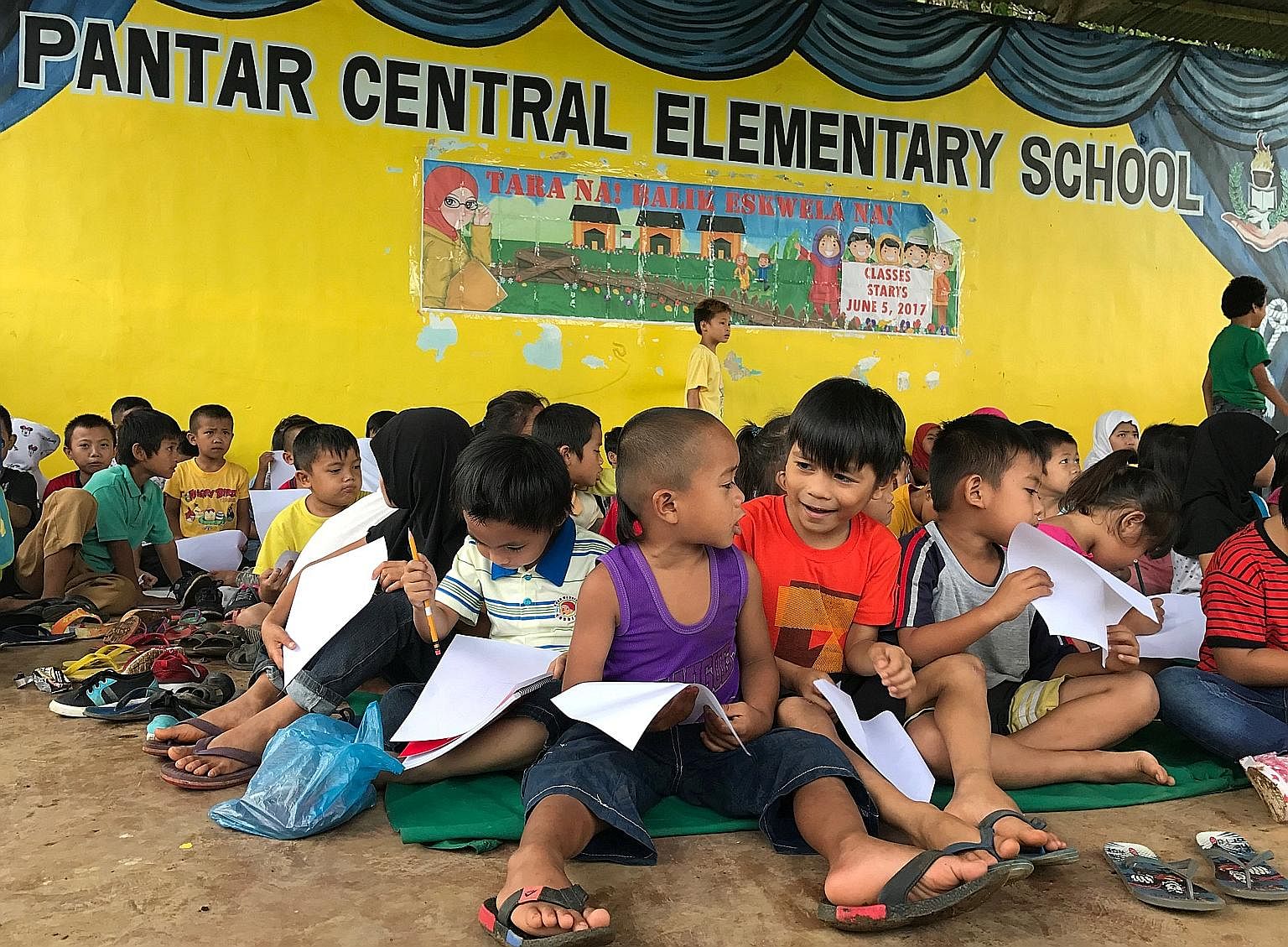 Children putting into drawing what they experienced before fleeing Marawi city at an elementary school in Lanao del Norte in the Philippines this month. Educating the next generation of Muslim youth will go a long way towards slowing the tide of ISIS