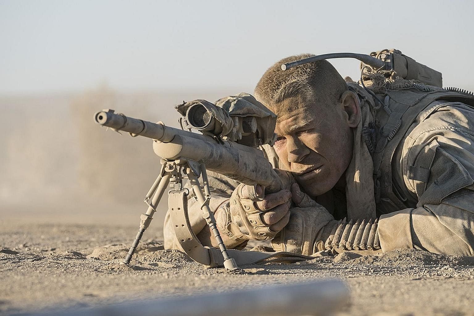 Wrestler-actor John Cena plays an American sniper in Iraq who is pinned down behind a crumbling wall by an unseen Iraqi sniper.