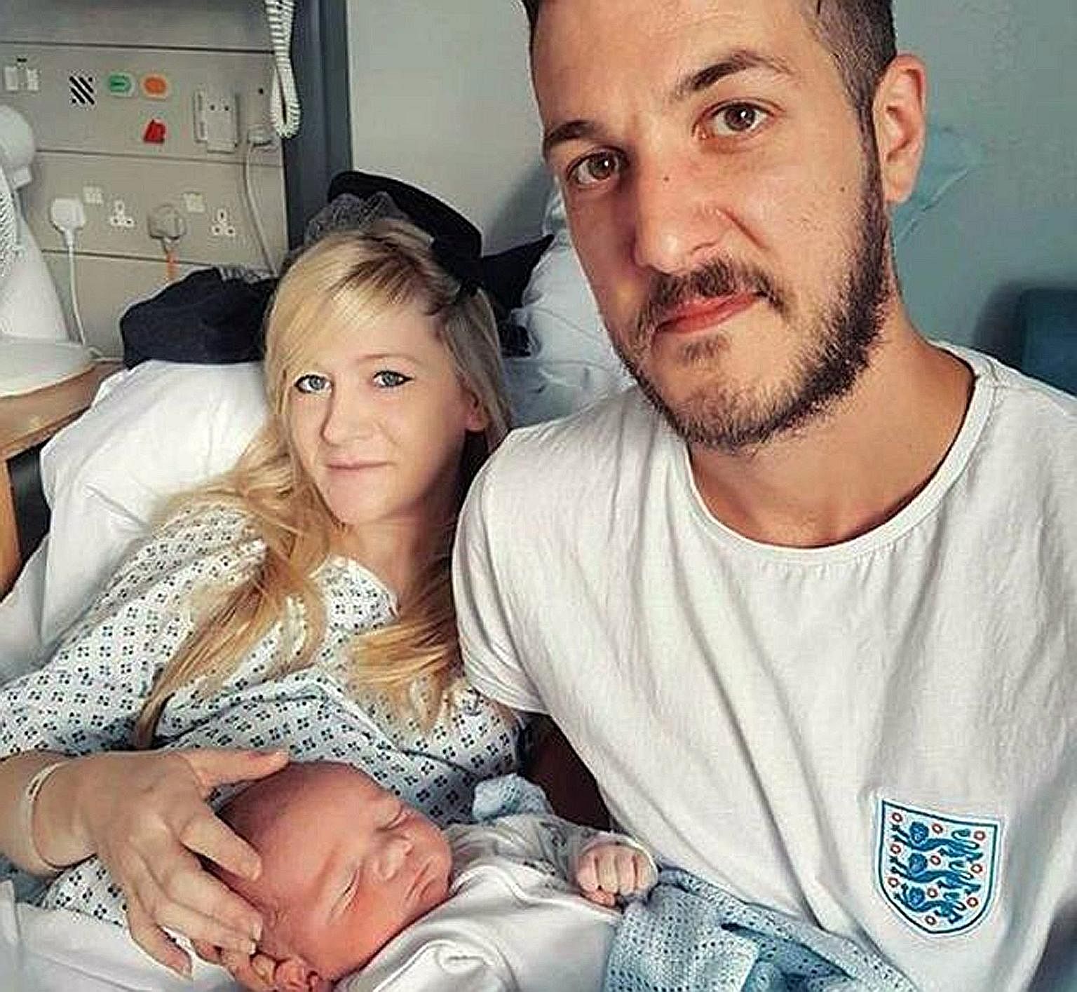 Ten-month-old Charlie Gard, who suffers from a rare genetic condition, with his parents, Ms Connie Yates and Mr Chris Gard. British courts have ruled that Charlie should be taken off life support as further treatment would prolong his suffering.