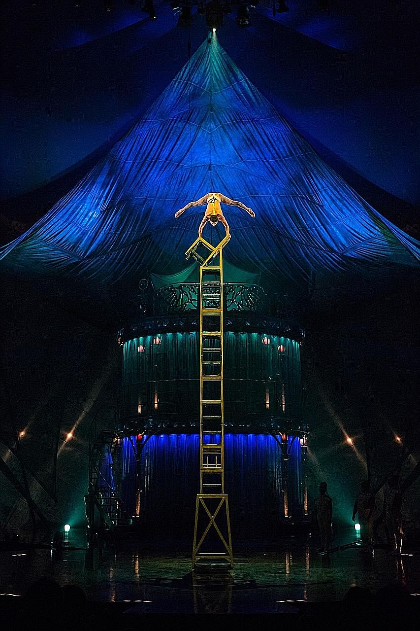 An artist in the chair-balancing act in Cirque du Soleil's Kooza show.