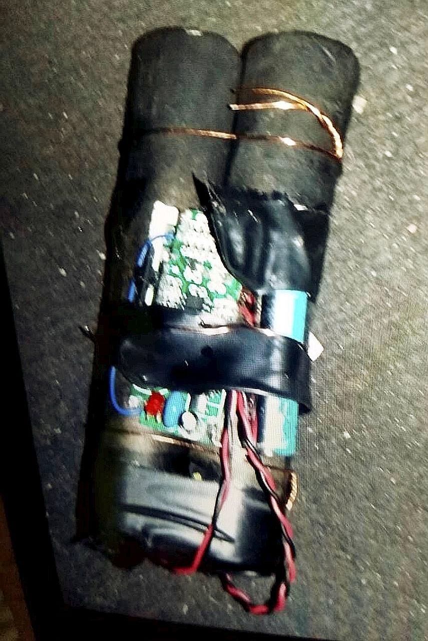 The improvised explosive device comprised two cylinders wrapped in black tape and wires as well as an electronic circuit board and a switch.