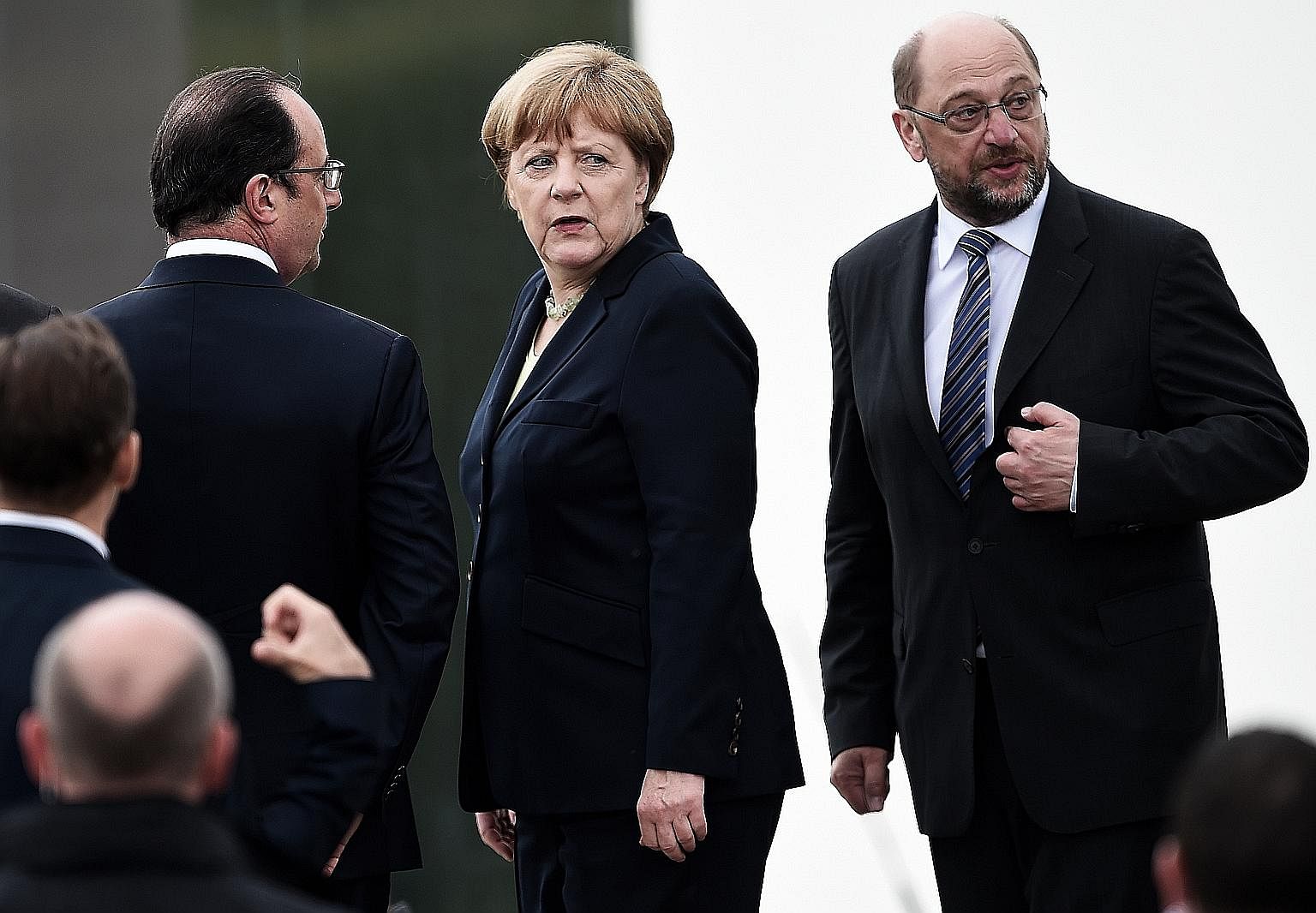 German Chancellor Angela Merkel, flanked by then French president Francois Hollande (left) and then European Parliament president Martin Schulz, at a ceremony last year in Douaumont, France, to mark the centenary of the Battle of Verdun. Mr Schulz's 