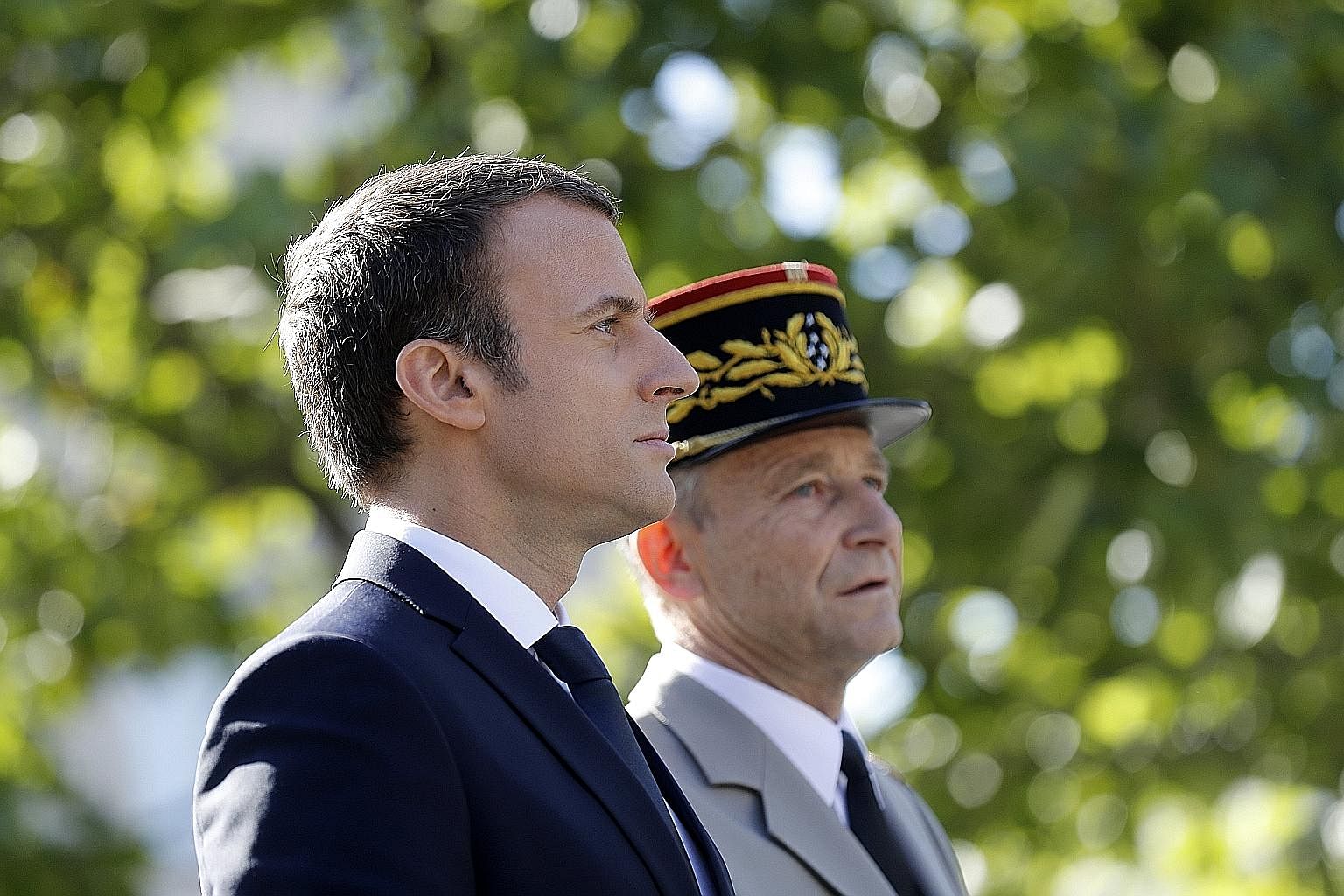 Mr Emmanuel Macron and General Pierre de Villiers at last year's Bastille Day parade. Gen de Villiers' resignation this week is a first by a head of the French military since 1958, and represents one of the biggest challenges to Mr Macron's authority