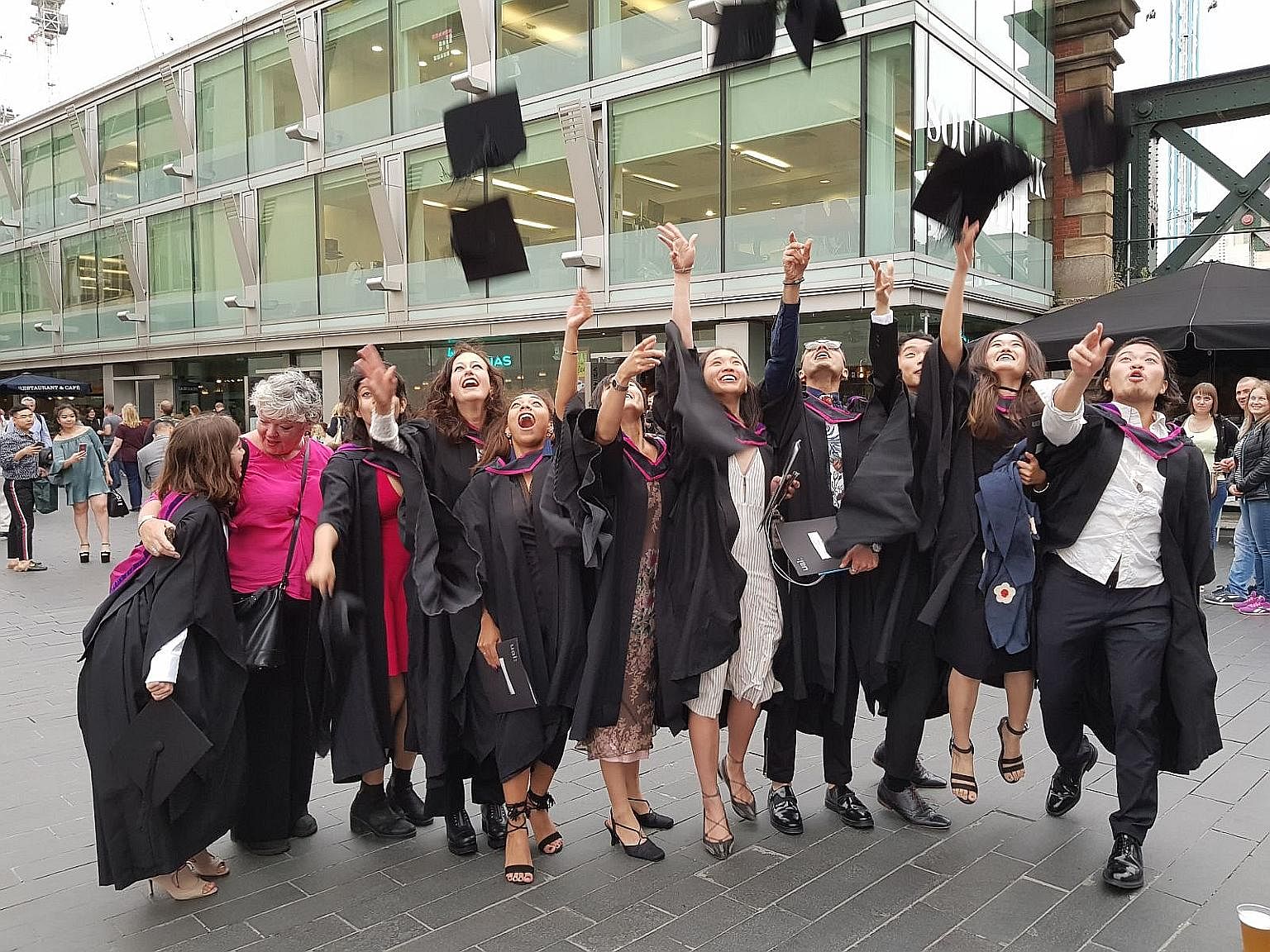 The writer's daughter, Ms Jacelyn Chua (fifth from right), at her graduation ceremony from the London College of Fashion last month. Ms Chua was advised to approach financial planning with a long-term perspective.