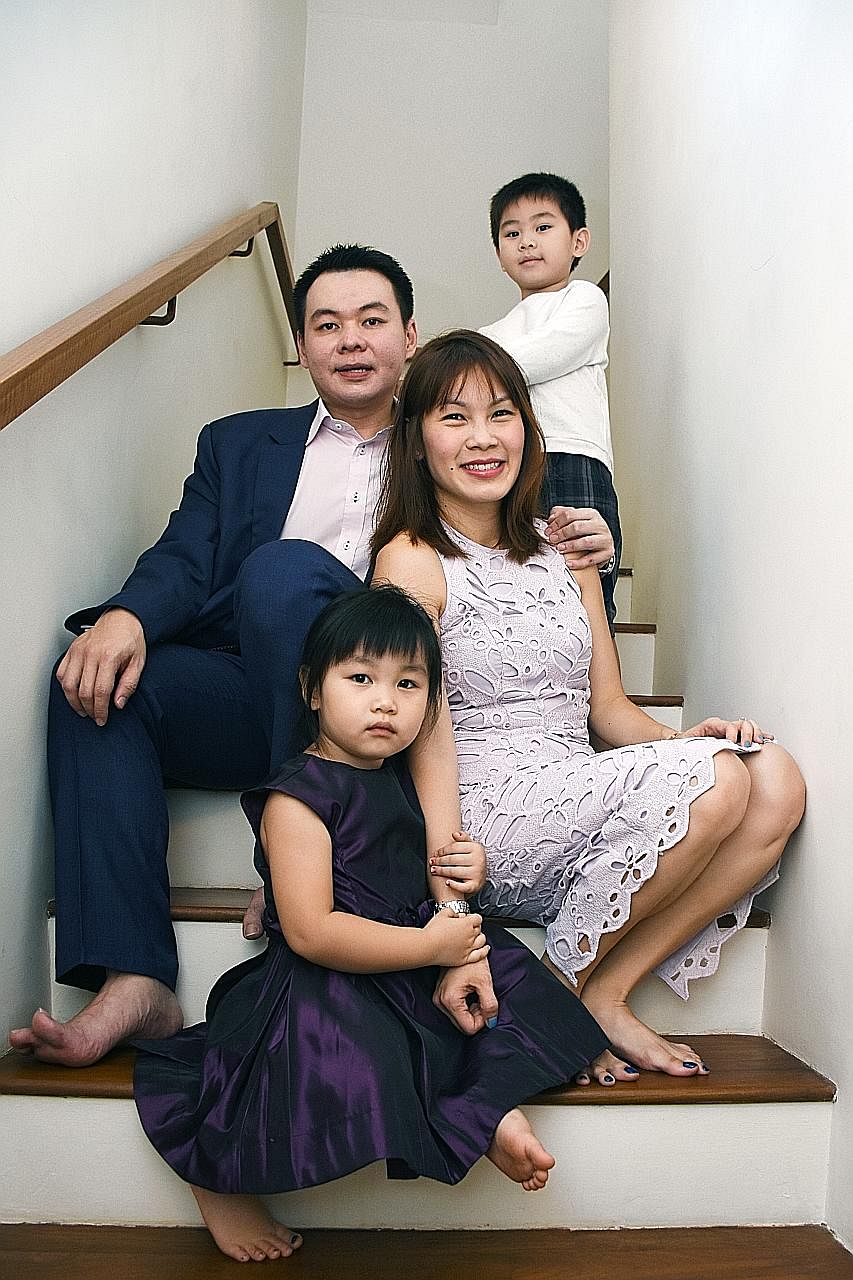 Mr Kelvin Lim with his wife Angela and their children, Gerald and Gabrielle, at their home in Braddell Road. Mr Lim fully insured the semi-detached house which he bought for $2.3 million in 2009.