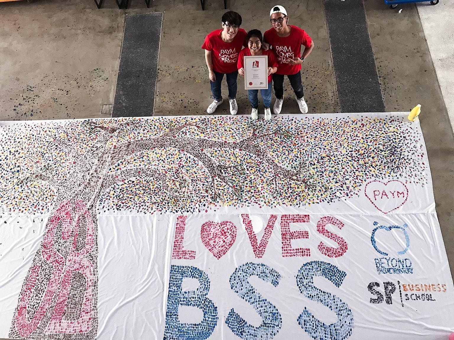 Singapore Polytechnic Business School now holds the Singapore record for the largest thumbprint art work. Done on a 3m by 6m canvas, the record-breaking venture saw 300 students from the business school contributing their fingerprints for the art wor