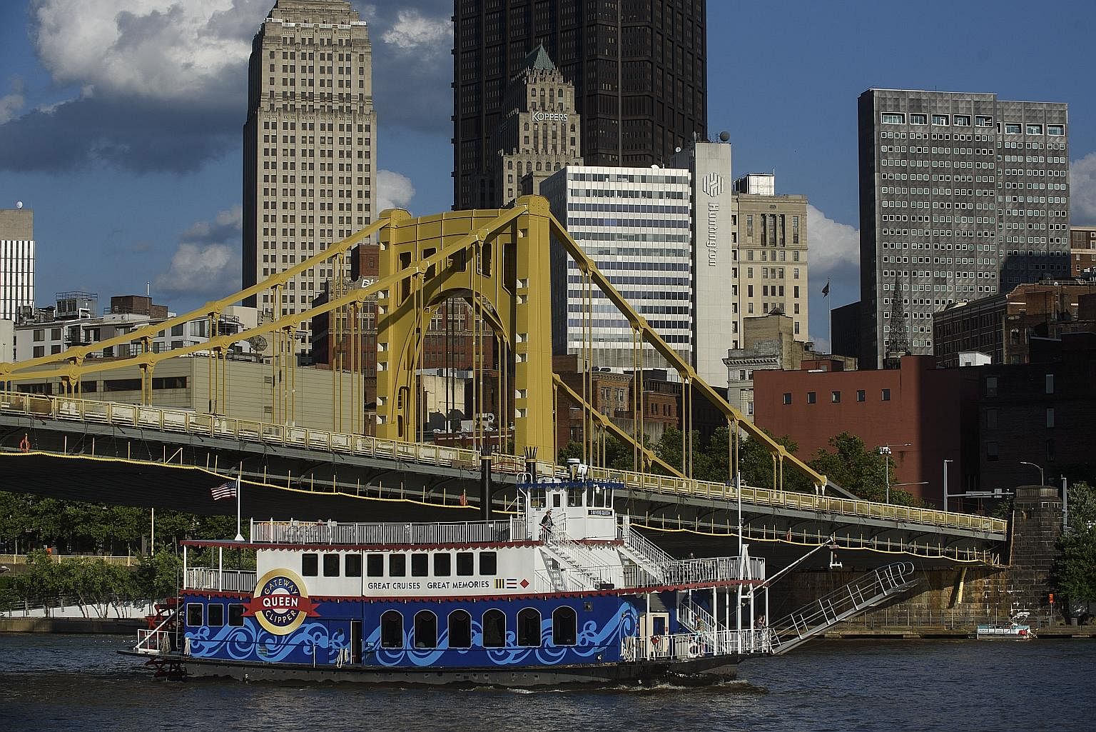 A riverboat plying the Allegheny River in Pittsburgh. Gone are the filthy smokestacks that once dominated the city's skyline. Today, a mixture of shiny new towers and historic old buildings rises above the river, while hip cafes and restaurants have sprun