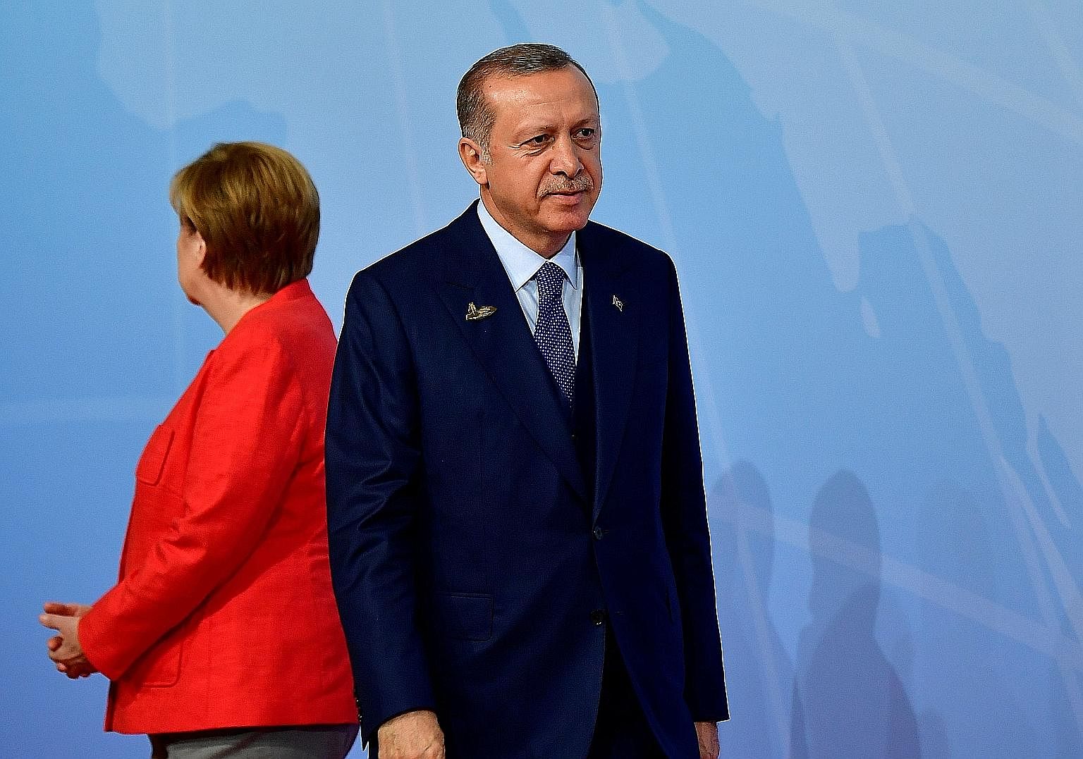 Chancellor Angela Merkel with her back to Mr Recep Tayyip Erdogan at last month's G-20 summit. Bilateral relations reached a nadir after Turkey arrested a journalist of Turkish descent working for a German newspaper.