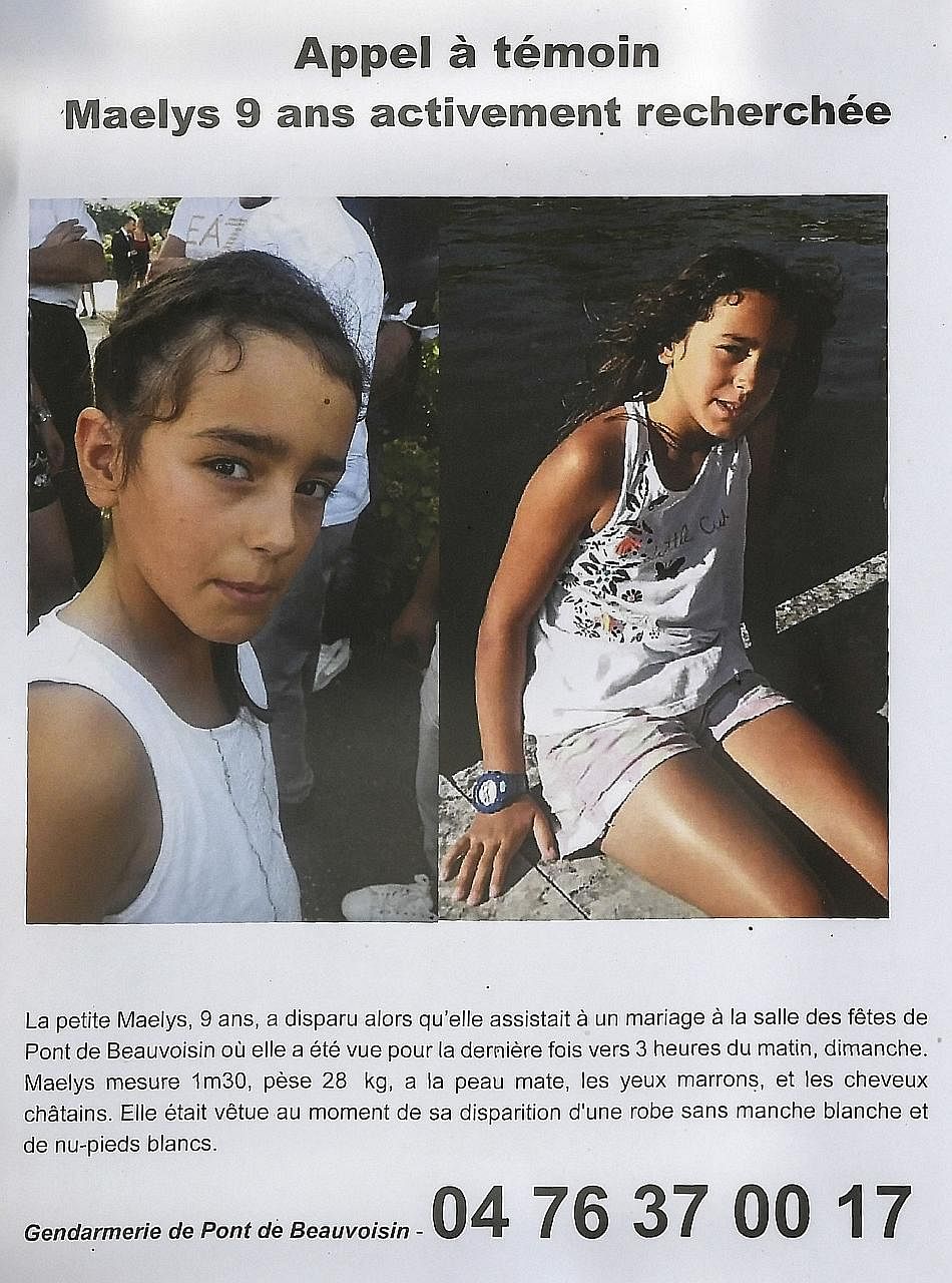 Police officers searching for evidence in Pont-de-Beauvoisin, south-eastern France, last Wednesday, after the disappearance of nine-year-old Maelys de Araujo (below, in an appeal for witnesses poster).