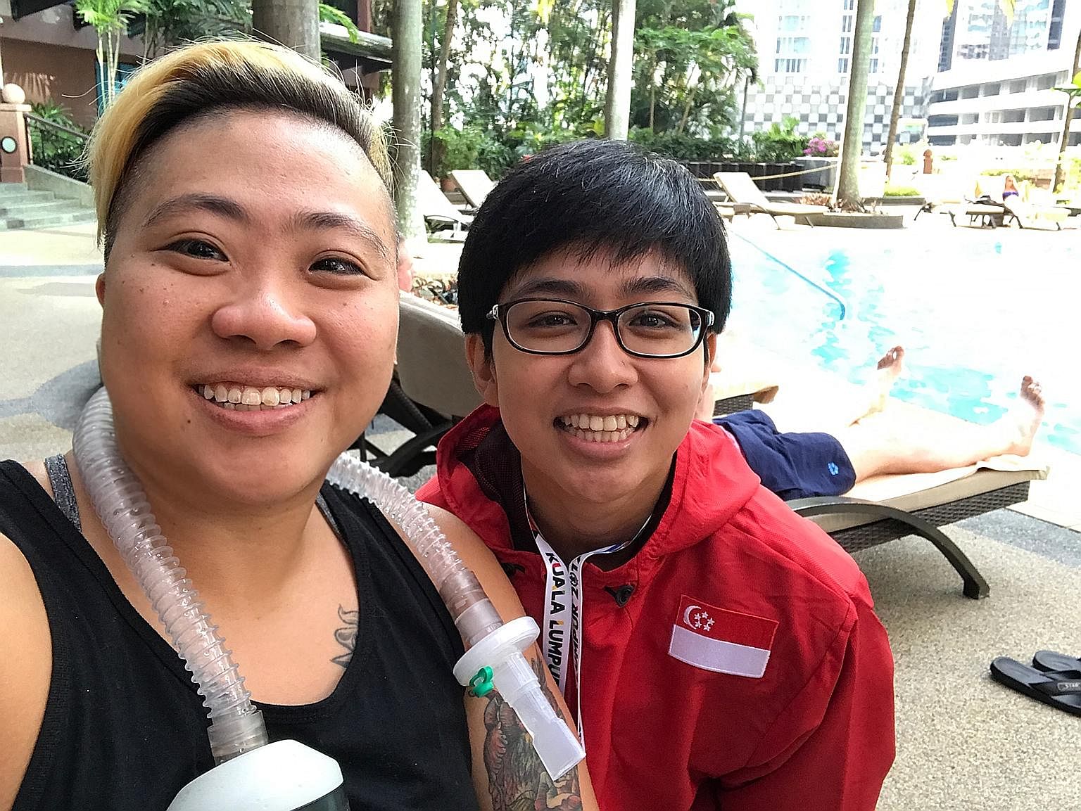 Para-swimmer Theresa Goh, a Paralympic bronze medallist, with Nur Aini Mohamad Yasli, a powerlifter making her Asean Para Games debut.