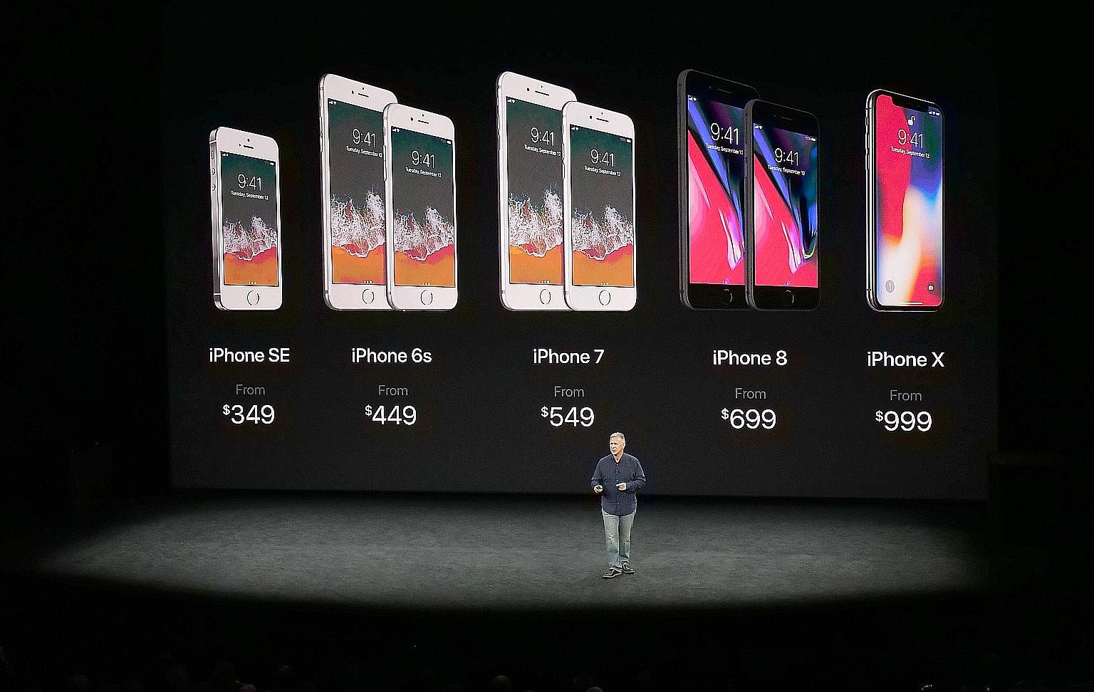 Apple marketing chief Phil Schiller showing the current line-up of iPhones during the special event held at Steve Jobs Theater in Cupertino earlier this month.