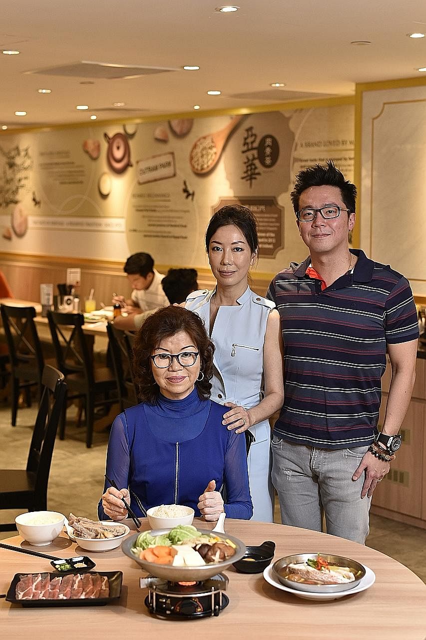 Madam Gwee Peck Hua (seated), founder of Ya Hua Bak Kut Teh, with her daughter Low Hwee Leng and son-in-law Wong Choon Yen and the eatery's steamboat porridge set. Mr Zhong Zhi Xin, co-owner of Ah Tou Seafood Bak Kut Teh, which specialises in the Kla