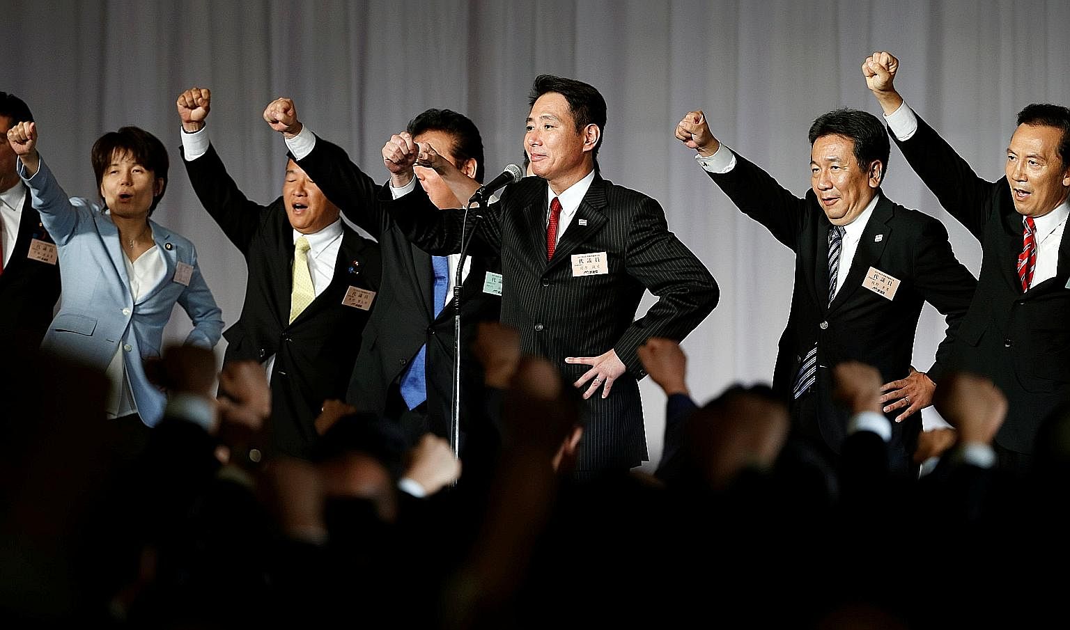 Mr Seiji Maehara with party members after they picked him to lead the Democratic Party, Japan's main opposition group, on Sept 1. Now, DP members say they would rather run as independents than back his tie-up with Kibo no To.