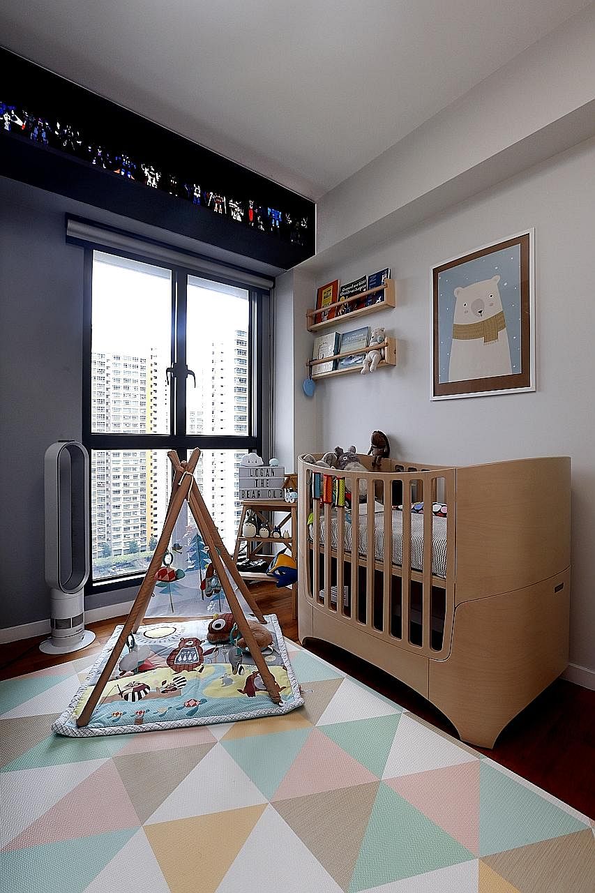 Upcycled wine crates are used as shelves in the living room, especially for the toy collections of home owners Marcus Wong and Gayle Tan (below, with their son, Logan Finn). The nursery (above) and master bedroom (right).