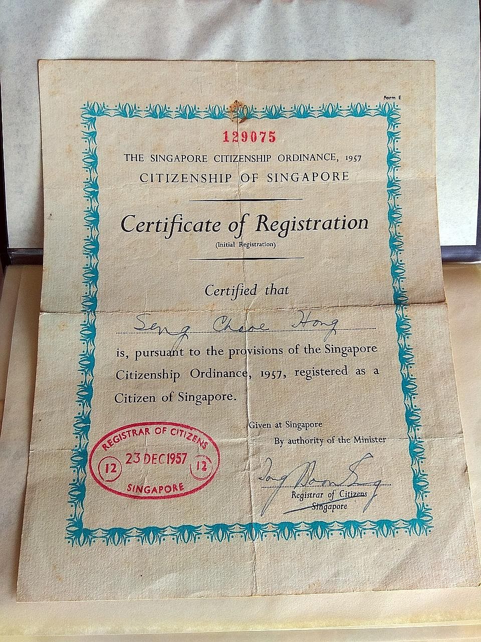 Mr Seng Chek Hong (above) registered as a Singapore citizen in 1957 (left), renouncing his Chinese citizenship. He did so at a time when others from China hesitated, said his grandson.