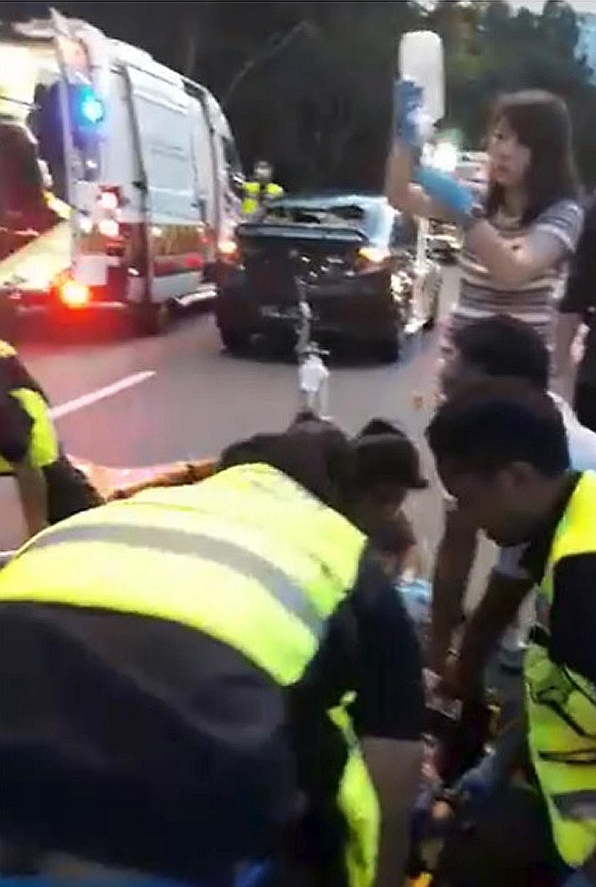 Far left: Paramedics attending to the four-year-old girl after she was hit by a car in Bukit Batok Central. Left: The spot where the accident happened. Barber Low Ko Chim said people often cross the road at this point, even though there is an overhea
