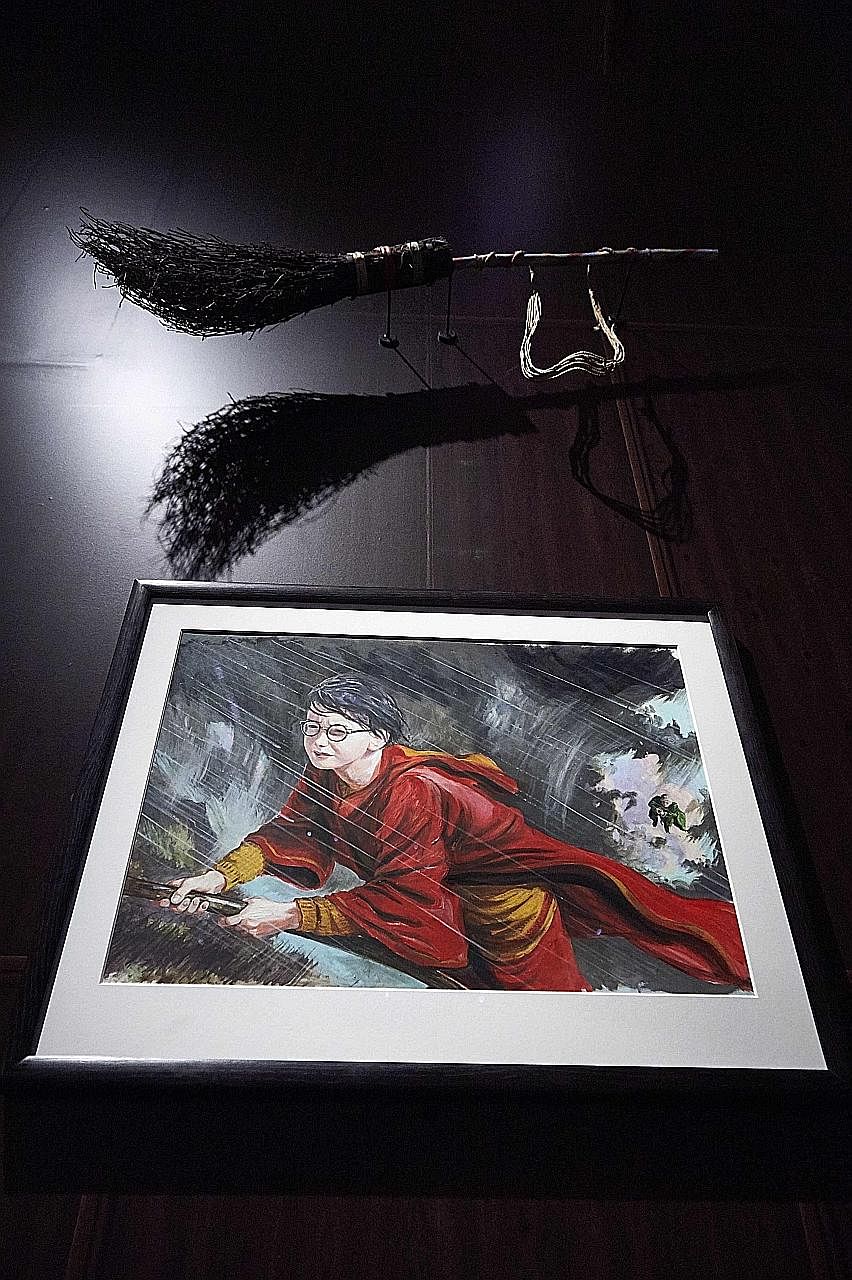 Held at the British Library in London, the Harry Potter: A History Of Magic exhibition features items such as books (top), a painting of Professor Dumbledore (above) and the Battersea Cauldron (right). A drawing of Harry Potter and his broomstick on 