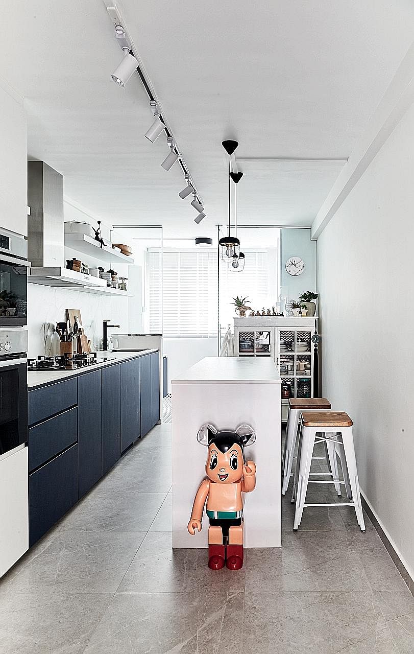 An Astro Boy piece adds a fun, quirky touch to the sleek kitchen.