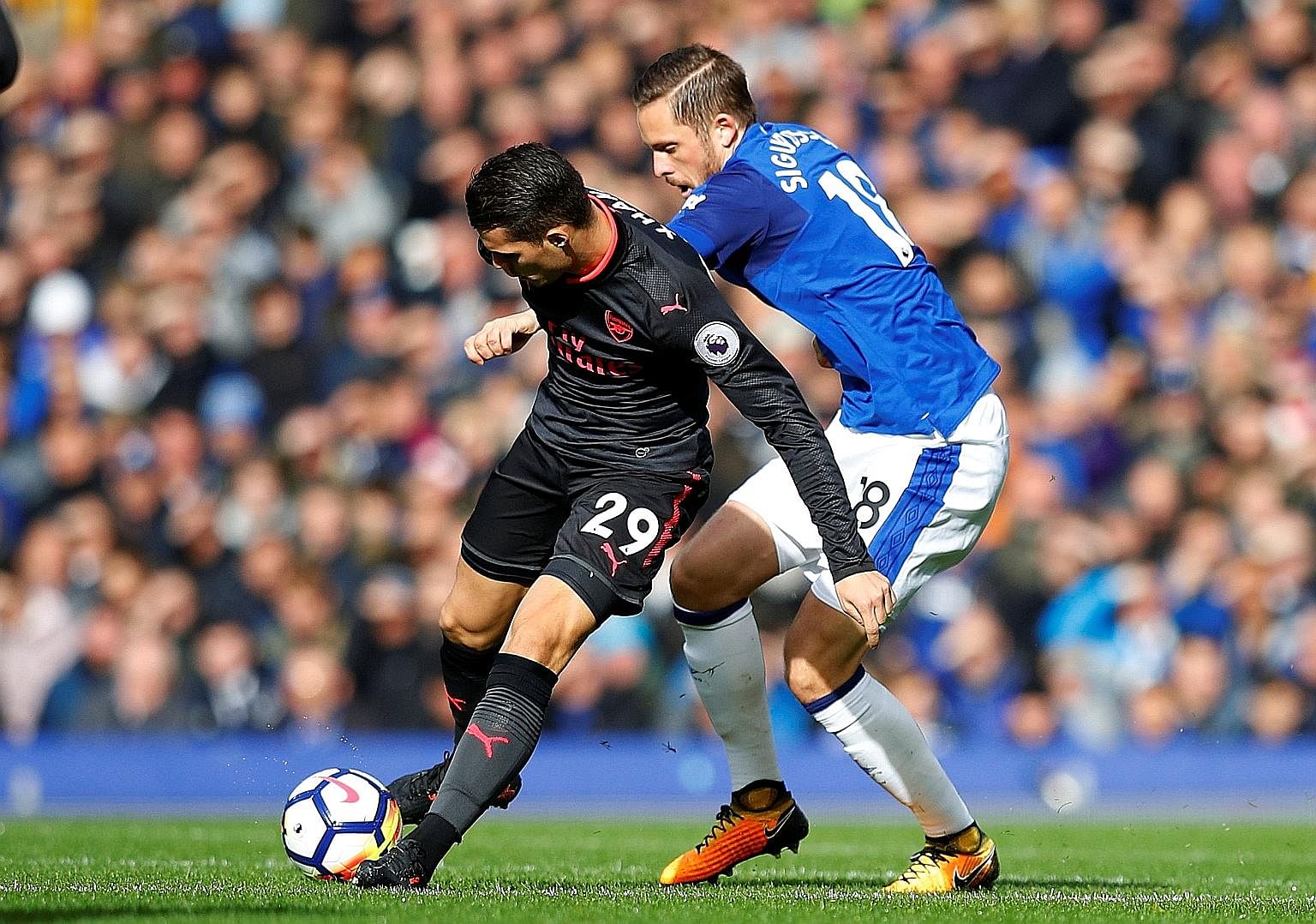 Arsenal's Granit Xhaka outsmarting Everton's Gylfi Sigurdsson during their Premier League encounter last Sunday. The Iceland midfielder, recruited from Swansea City in August, received praise from Ronald Koeman despite below-par performances.
