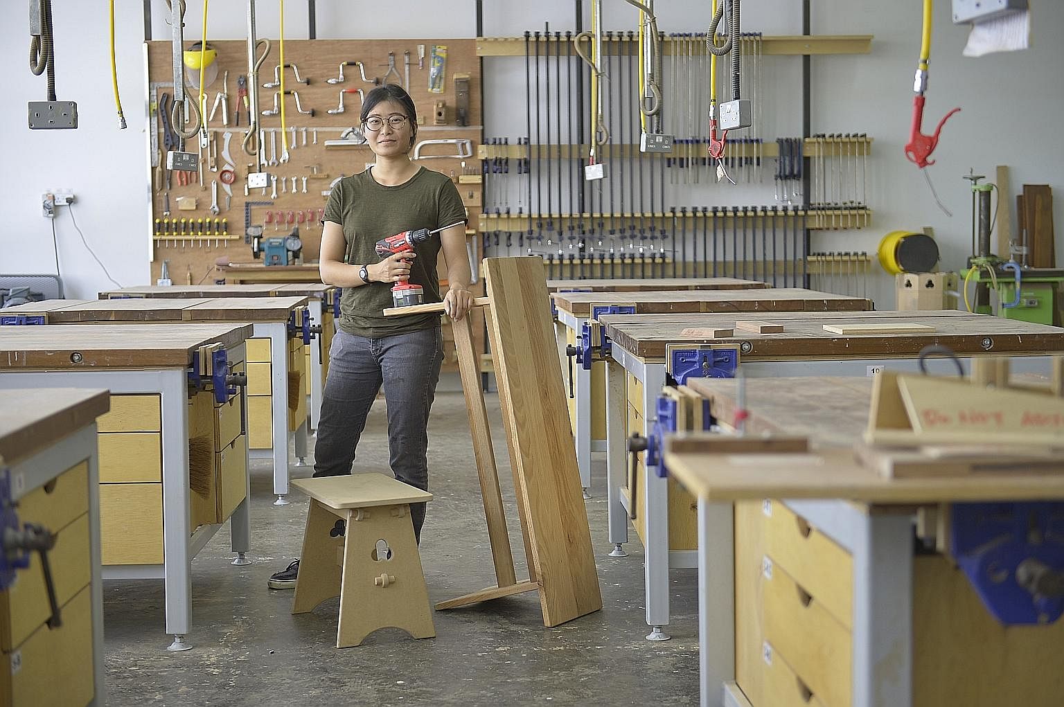 Ms Kwa Mei Jun at the Singapore Furniture Industries Council Institute's training workshop in Sungei Kadut. After her A levels, she did a one-year wood craftsmanship apprentice course run by the institute, where she worked in a furniture factory and 