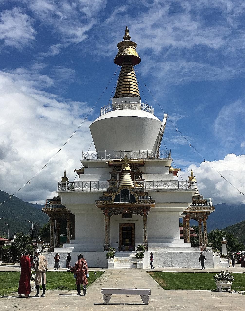 Tiger's Nest is a monastery in Bhutan that is 3,120m above sea level. A panoramic view of Paro Valley. The market in Phobjikha (above) and the Thimphu Memorial Stupa (left).