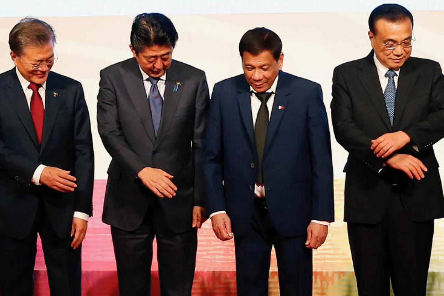 Japan says it will hold summit with China and South Korea soon but 'not ...