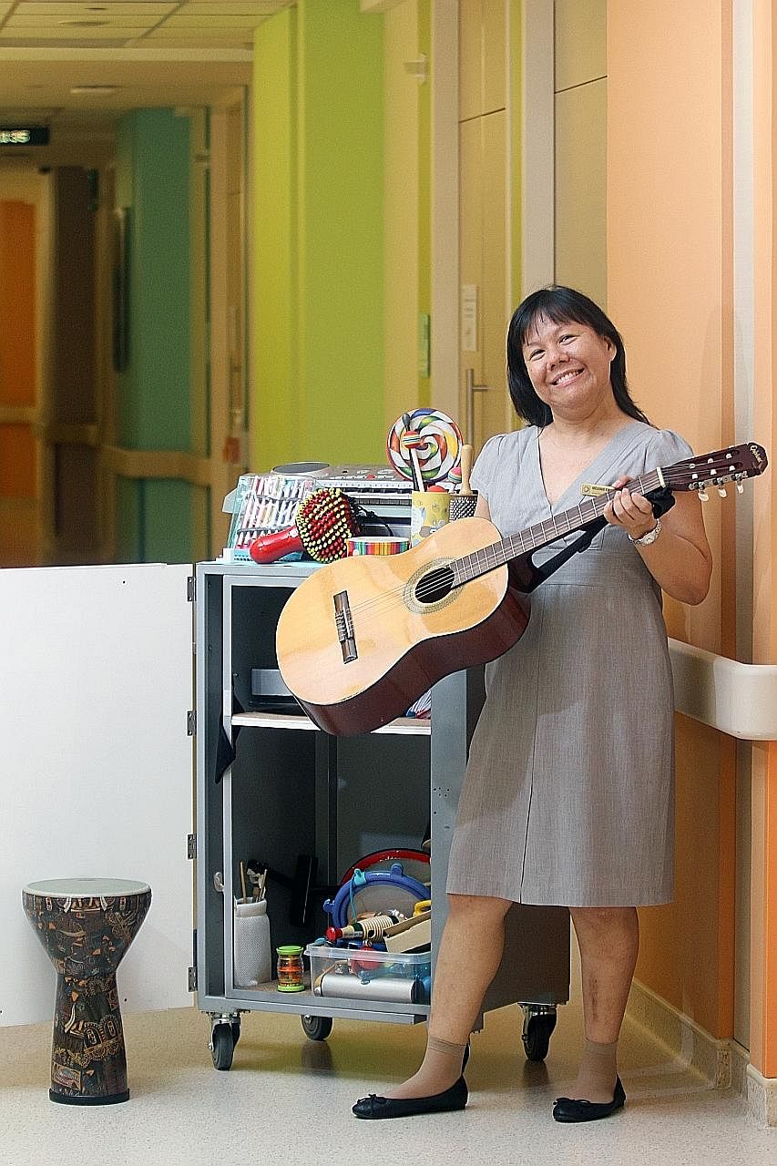 Senior music therapist Melanie Kwan with her collection of musical instruments that she uses according to a patient's needs. "I am there for patients in difficult moments as well as positive ones," she says.