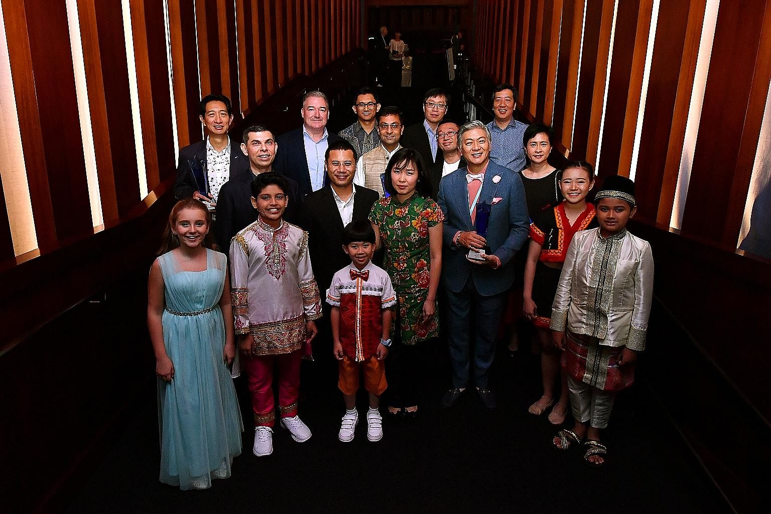 Young performers (first row, from left) Laura Maurer-Stroh and Aadeetiya Jayashanker, both aged 11; Estovan Cheah, seven; Cerilynn Law, 14; and Syah Rizuan Huslan, 12; (second row, from left) Mr Warren Fernandez, The Straits Times' editor and editor-