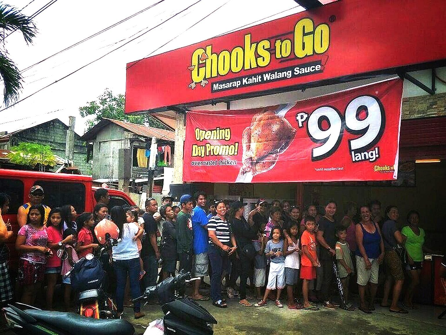 Long queues at a Chooks To Go outlet outside Manila. The Philippines' largest rotisserie chicken chain has over 1,500 kiosks across the country, and its popularity has been a symbol of high consumer demand.