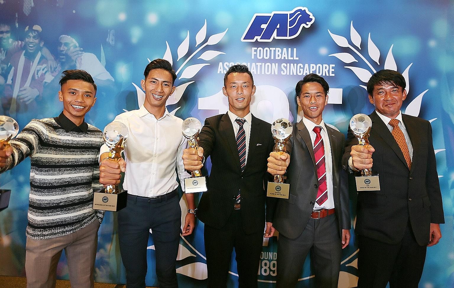 From left: Hazzuwan Halim, Huzaifah Aziz, Tsubasa Sano, Kento Nagasaki and Kazuaki Yoshinaga after receiving their trophies at the inaugural Football Association of Singapore (FAS) Nite at Marina Bay Sands Convention Centre yesterday.
