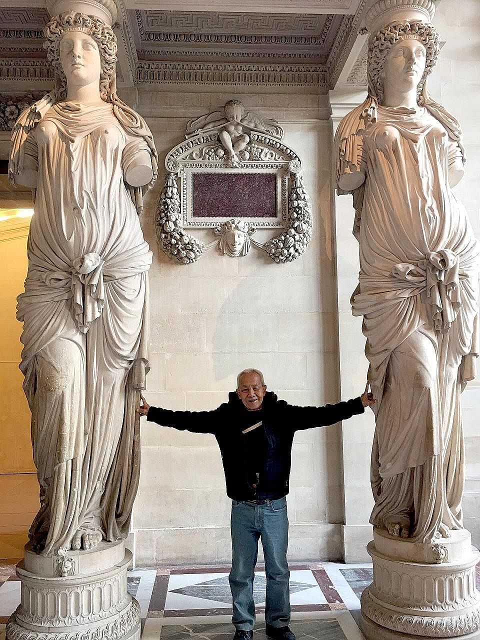 Right: Mr Sum at the Louvre Museum during his five-day trip to Paris two weeks ago, sponsored by an ST reader.